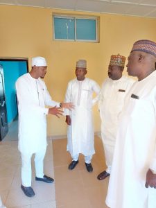 The new DG. of Niger State Housing Corporation Bashir Yakubu Harka in a group conversation during his assumption of office